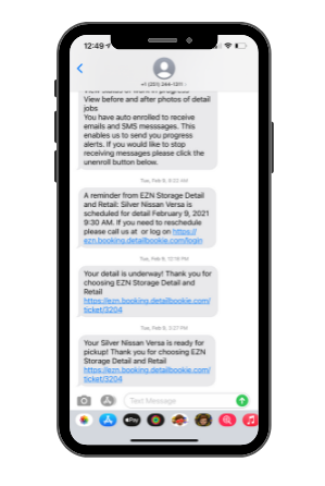 Smartphone screen displaying text messages about car detailing appointments with links included.
